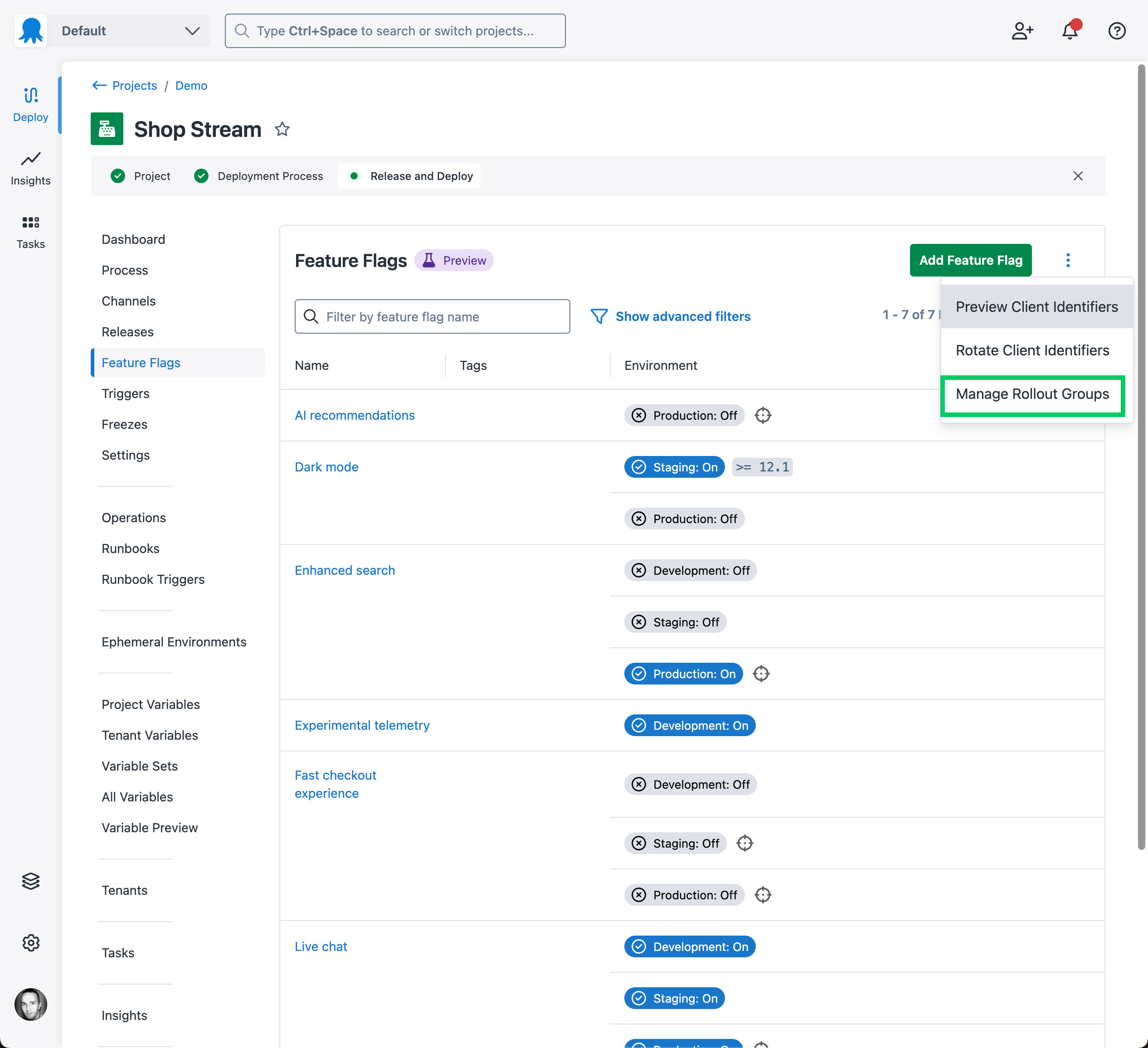 Screenshot of feature flags list page with overflow menu expanded highlighting the manage rollout groups button